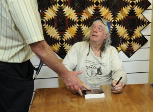 Brian signing books